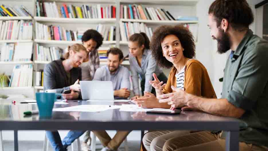 Collaboration and analysis by business people working in modern office