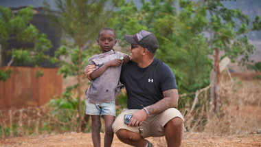 Kiran Fraser-Neve with local child