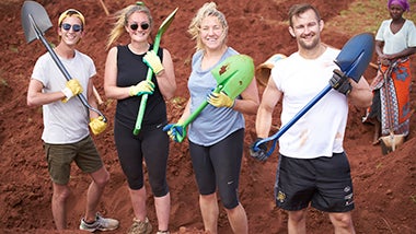 Global Angels volunteers with shovels