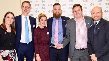Robert Walters Group staff hold up award at Great Ormond Streat Hospital Children's Charity Better Together Event