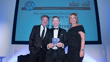 Robert Walters staff hold up Best International Recruiter 2017 award at awards ceremony 