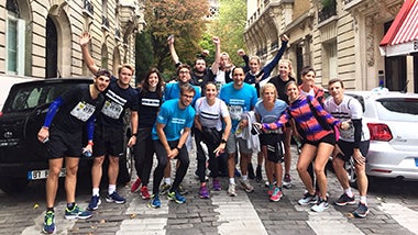 Paris Marathon group group of runners finishing marathon