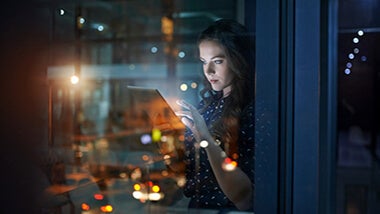 lady-at-window-on-tablet