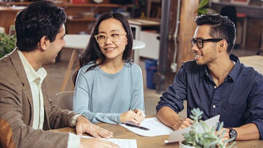 man and woman in a meeting